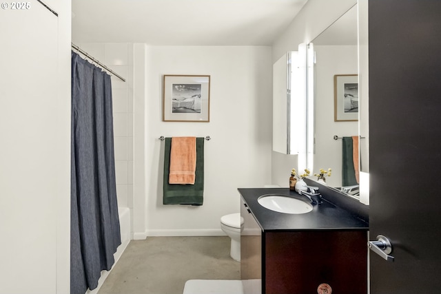 bathroom with vanity, shower / bath combination with curtain, toilet, and baseboards