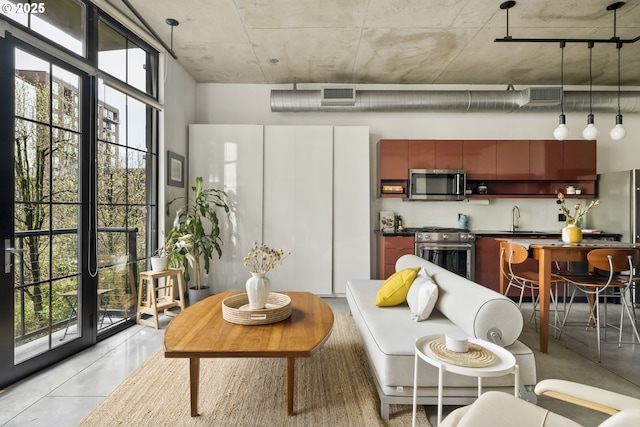 living area featuring visible vents and plenty of natural light