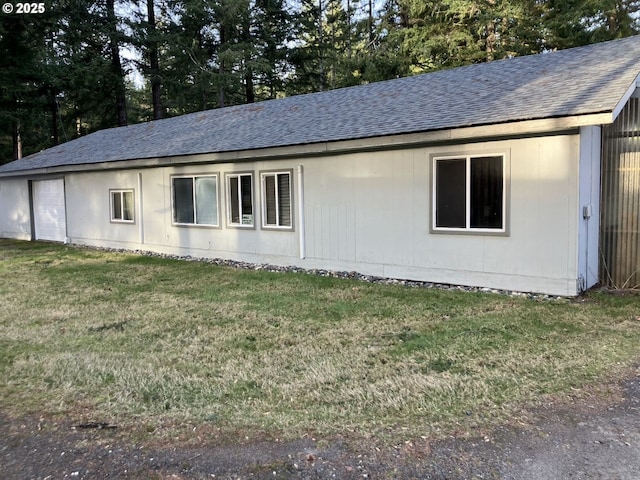 view of property exterior featuring a lawn