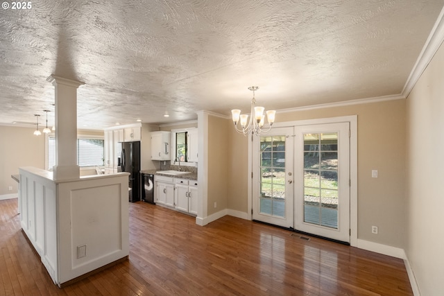 1221 SW Maple St, Dallas, OR 97338 - kitchen featuring a chandelier, dark wood-type flooring, a sink, black appliances, and white cabinets