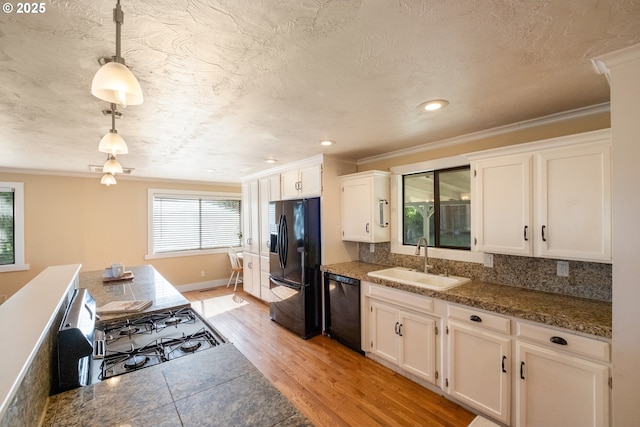 1221 SW Maple St, Dallas, OR 97338 - kitchen with black appliances, a sink, crown molding, white cabinets, and recessed lighting