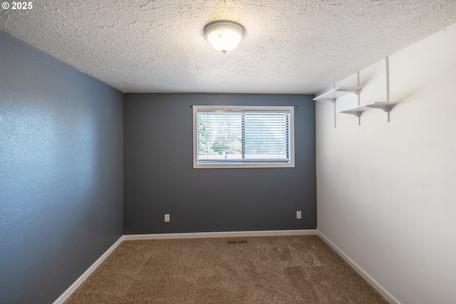 1221 SW Maple St, Dallas, OR 97338 - carpeted empty room featuring baseboards and a textured ceiling