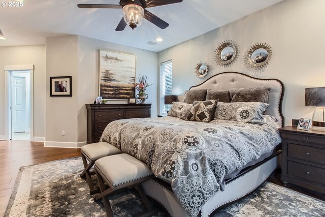 bedroom featuring ceiling fan, access to exterior, and hardwood / wood-style floors