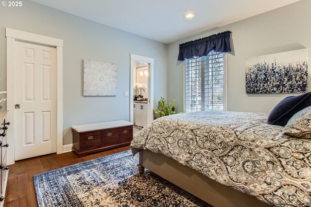 bathroom featuring a shower with shower door, vanity, ceiling fan, and wood-type flooring