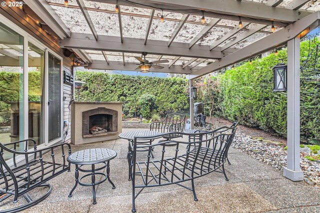 view of patio / terrace with an outdoor fireplace and a pergola