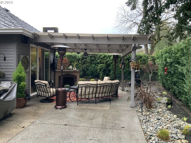 view of patio with exterior fireplace and a pergola