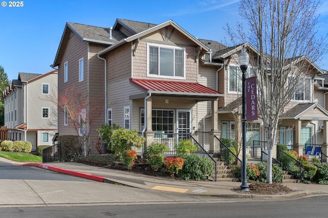 townhome / multi-family property featuring a standing seam roof and metal roof