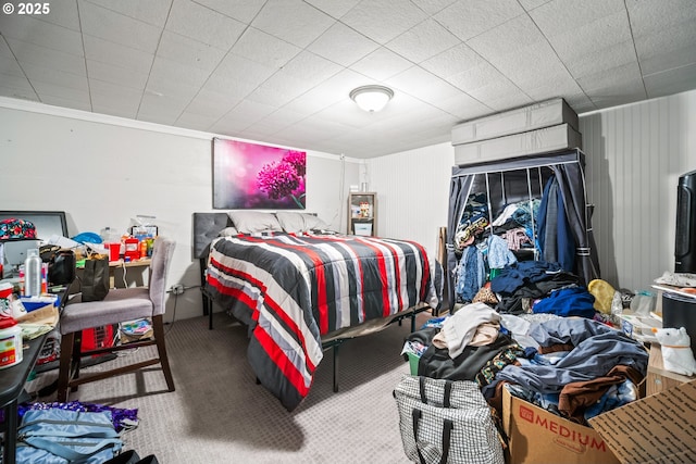 bedroom with carpet and crown molding