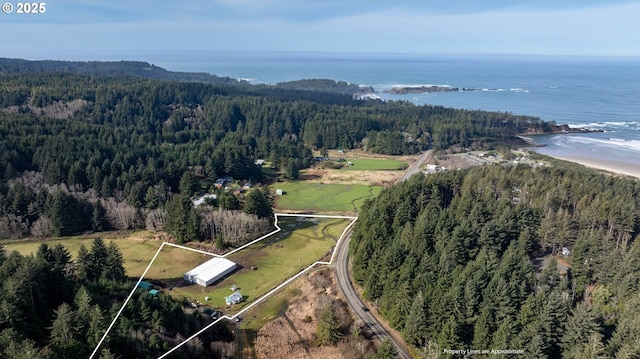 aerial view with a water view and a wooded view