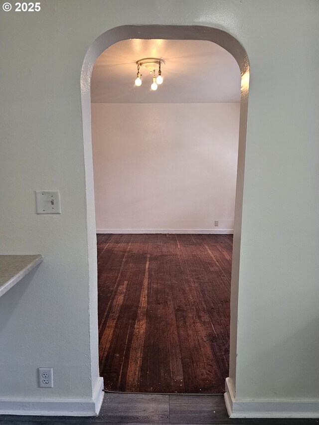 617 SW 3rd St, Pendleton, OR 97801 - corridor with arched walkways, wood finished floors, and baseboards