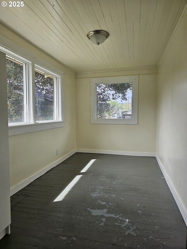 617 SW 3rd St, Pendleton, OR 97801 - empty room featuring dark wood finished floors, wood ceiling, baseboards, and crown molding