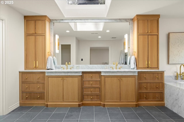 6230 SW Patton Rd, Portland, OR 97221 - full bath with tile patterned floors, double vanity, a skylight, and recessed lighting