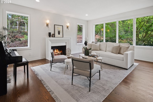 6230 SW Patton Rd, Portland, OR 97221 - living room featuring healthy amount of natural light, a warm lit fireplace, baseboards, and recessed lighting