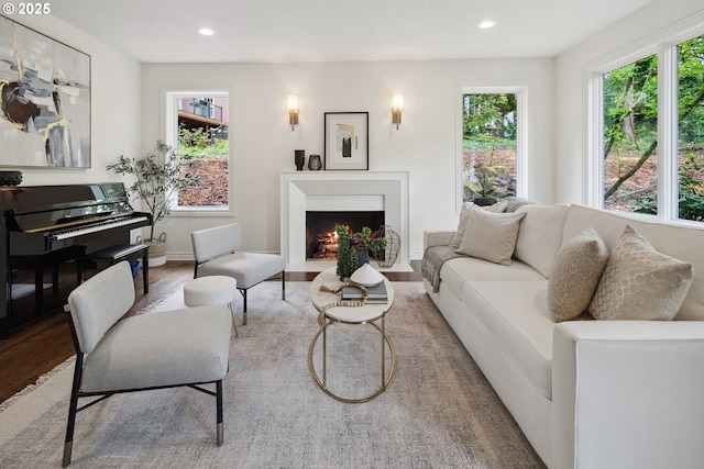 6230 SW Patton Rd, Portland, OR 97221 - living room featuring wood finished floors, recessed lighting, a fireplace with flush hearth, and baseboards