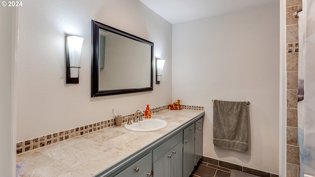 full bath with tile patterned floors, walk in shower, and vanity