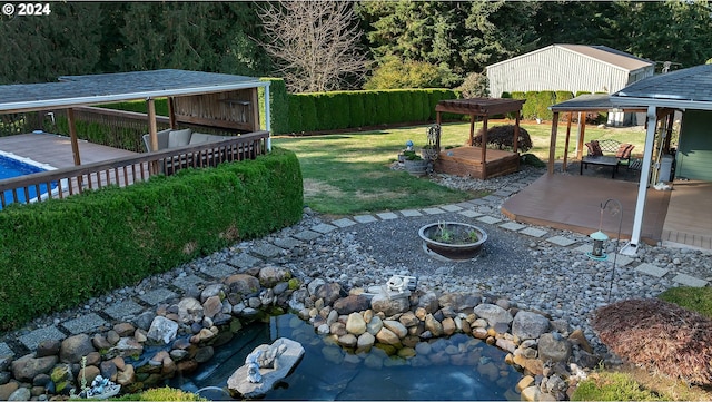 view of yard with fence, a patio, a gazebo, and a deck