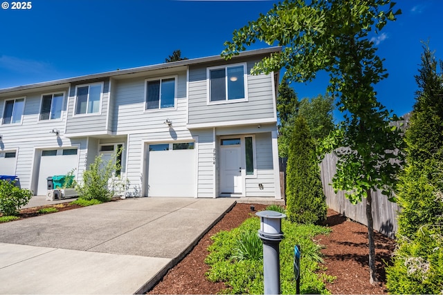 2904 SE 87th Ave, Portland, OR 97266 - view of front facade featuring concrete driveway, fence, and an attached garage