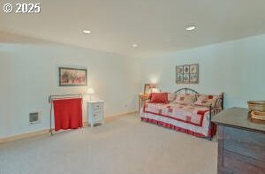 carpeted bedroom with recessed lighting