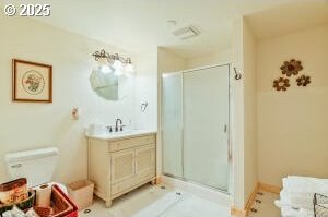 bathroom featuring a stall shower and vanity