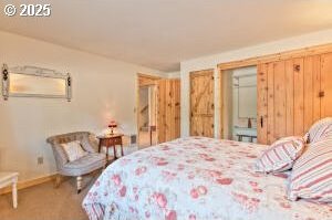 carpeted bedroom featuring baseboards