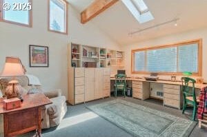 office featuring vaulted ceiling with skylight and plenty of natural light