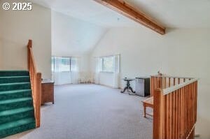 additional living space featuring carpet flooring, lofted ceiling with beams, and stairs