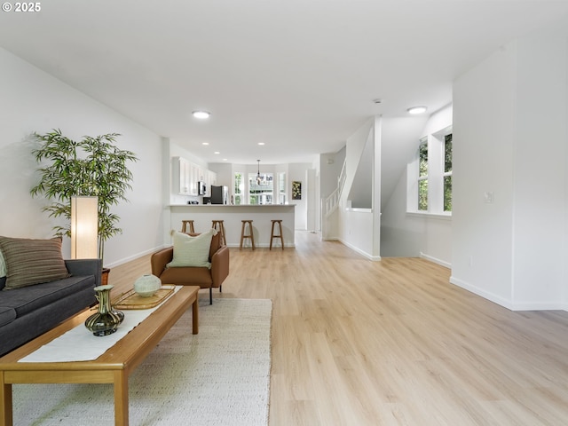 7804 SW Brookline Ln, Portland, OR 97224 - living area with light wood finished floors, recessed lighting, and a chandelier