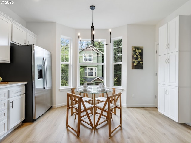 7804 SW Brookline Ln, Portland, OR 97224 - dining room featuring light wood-type flooring, plenty of natural light, and a chandelier
