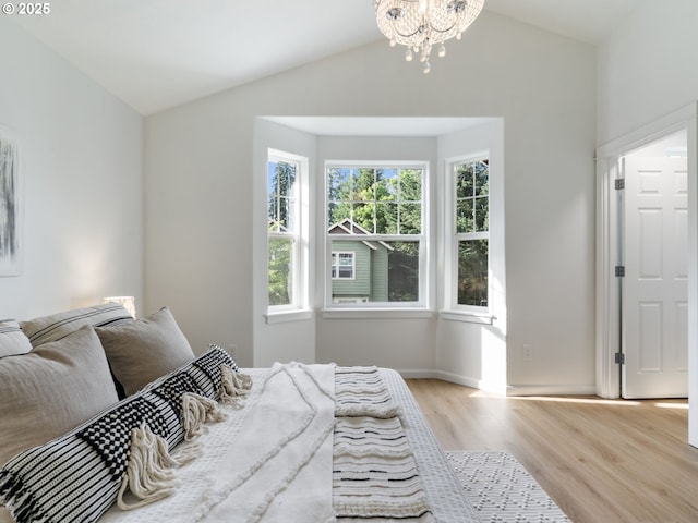 7804 SW Brookline Ln, Portland, OR 97224 - bedroom with lofted ceiling, wood finished floors, and a chandelier