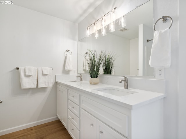 7804 SW Brookline Ln, Portland, OR 97224 - bathroom featuring double vanity and wood finished floors
