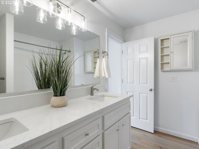 7804 SW Brookline Ln, Portland, OR 97224 - bathroom featuring double vanity and wood finished floors