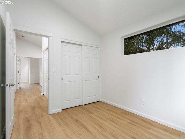 7804 SW Brookline Ln, Portland, OR 97224 - unfurnished bedroom featuring lofted ceiling, light wood finished floors, and a closet