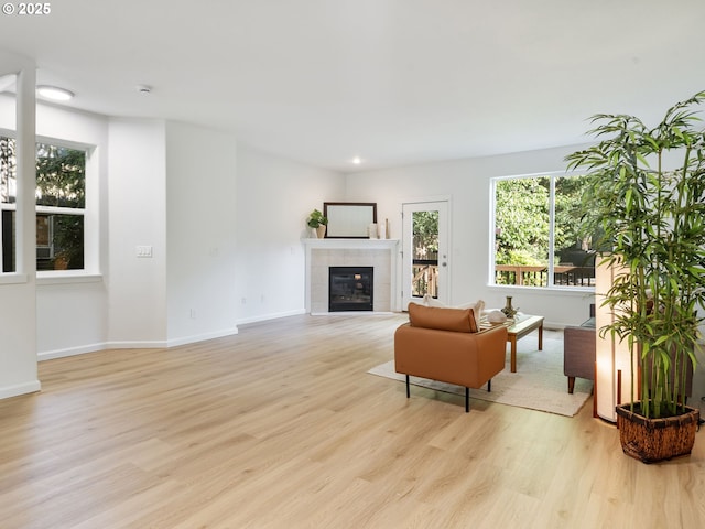 7804 SW Brookline Ln, Portland, OR 97224 - living area with light wood finished floors, plenty of natural light, and a tile fireplace