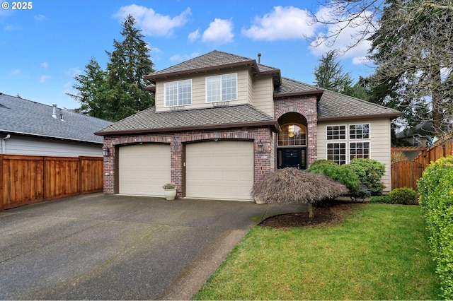 view of front property featuring a front yard and a garage