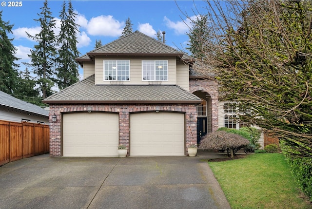 front of property featuring a garage and a front lawn