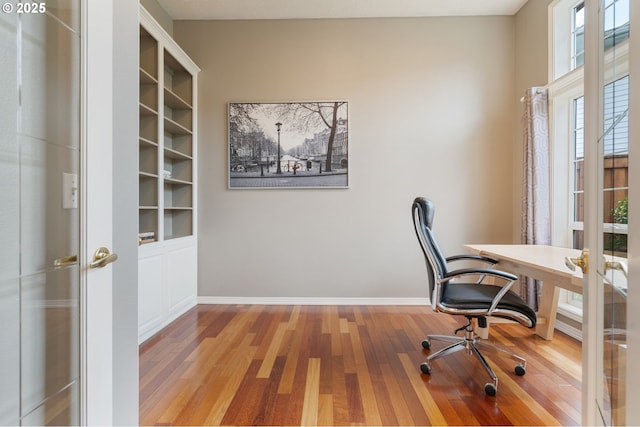 office area with hardwood / wood-style floors