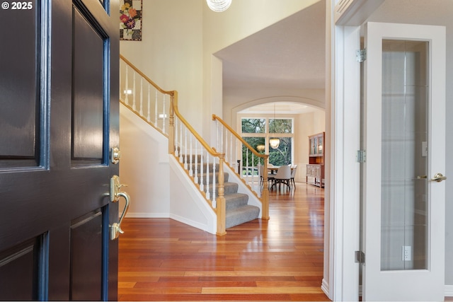 foyer with wood-type flooring