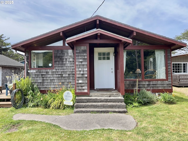 25760 Nedonna Ave, Rockaway Beach, OR 97136 - doorway to property with a lawn