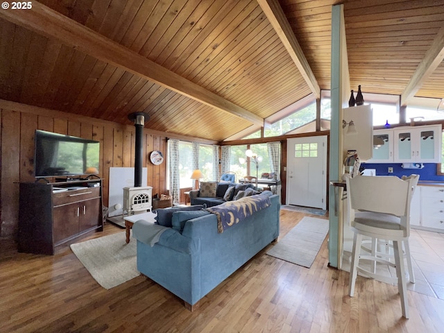 25760 Nedonna Ave, Rockaway Beach, OR 97136 - living area featuring wooden ceiling, wood finished floors, and a wood stove