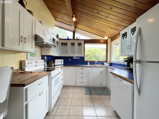 25760 Nedonna Ave, Rockaway Beach, OR 97136 - kitchen with white appliances, under cabinet range hood, wood ceiling, lofted ceiling, and light tile patterned floors