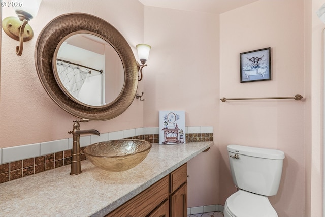 15711 NE 27th Cir, Vancouver, WA 98684 - bathroom with vanity, toilet, and backsplash