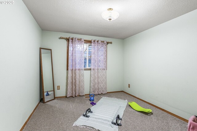 15711 NE 27th Cir, Vancouver, WA 98684 - exercise room with carpet floors, baseboards, and a textured ceiling