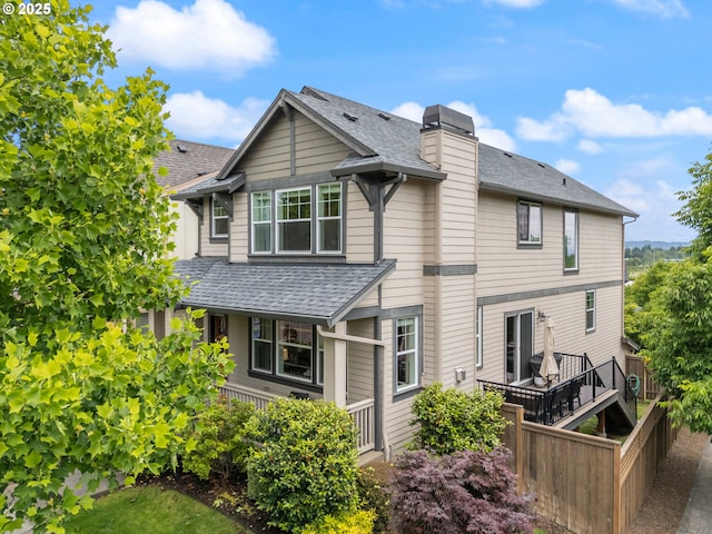 29250 SW Costa Cir E, Wilsonville, OR 97070 - back of house with a shingled roof and a chimney