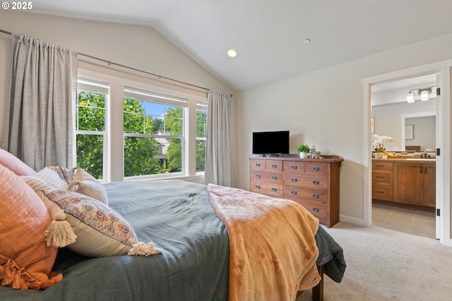 29250 SW Costa Cir E, Wilsonville, OR 97070 - bedroom with vaulted ceiling, a sink, light carpet, ensuite bathroom, and recessed lighting