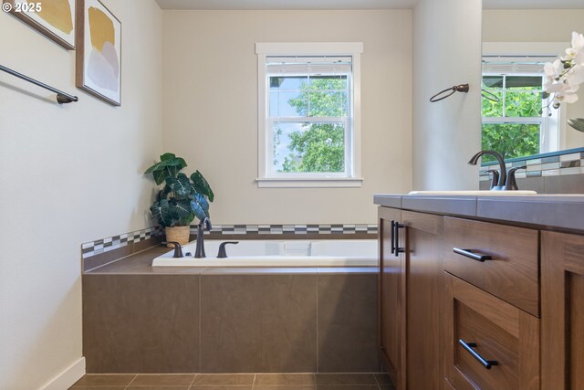 29250 SW Costa Cir E, Wilsonville, OR 97070 - bathroom featuring a garden tub, vanity, and tile patterned flooring