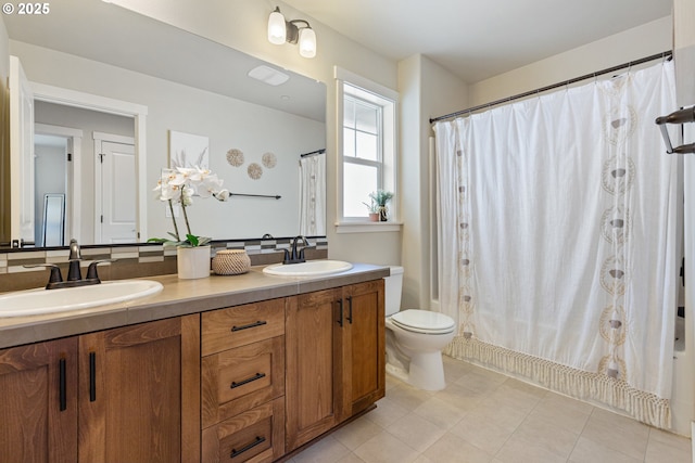 29250 SW Costa Cir E, Wilsonville, OR 97070 - bathroom with double vanity, toilet, and a shower with curtain