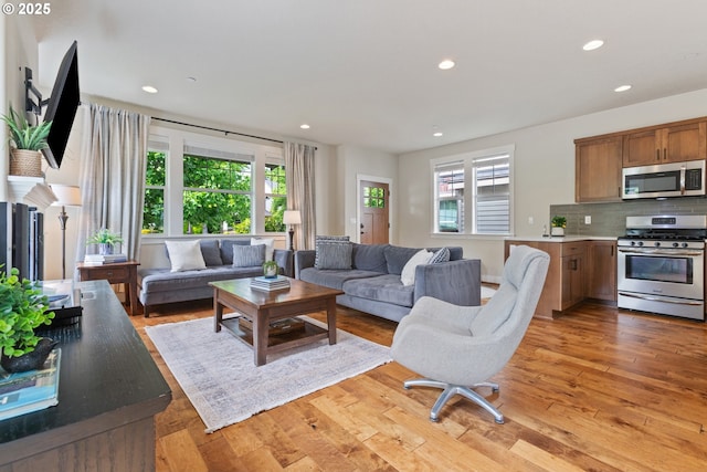 29250 SW Costa Cir E, Wilsonville, OR 97070 - living room featuring recessed lighting and light wood-type flooring