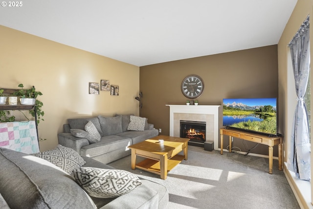 living room featuring carpet floors and a tile fireplace