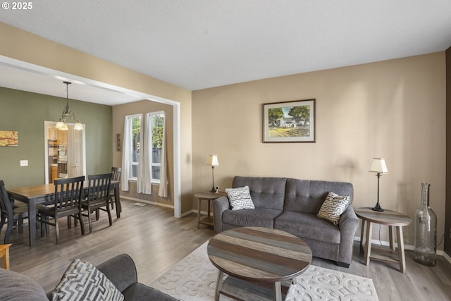 living room featuring baseboards and wood finished floors