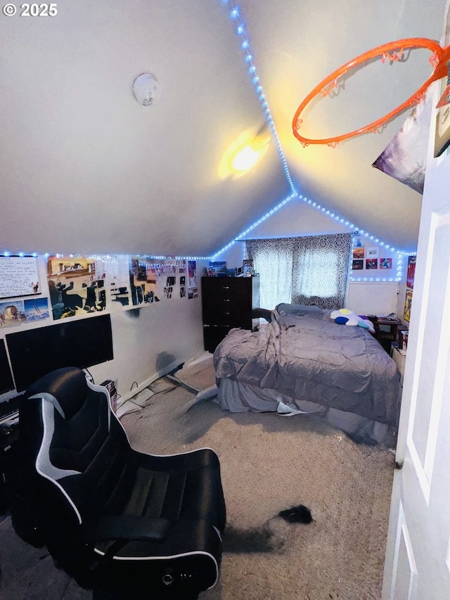 carpeted bedroom featuring lofted ceiling